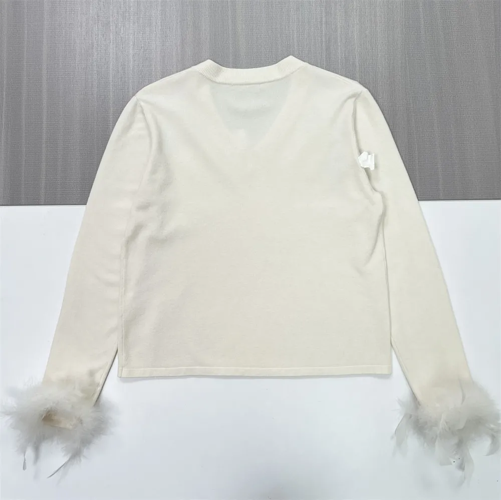 Women's Ivory V-Neck Sweater with Feather Cuff Detail - Custom Elegant Casual Apparel