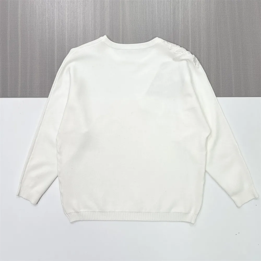 Women's White Knit Sweater with Shimmery Floral & Feather Shoulder Embellishment